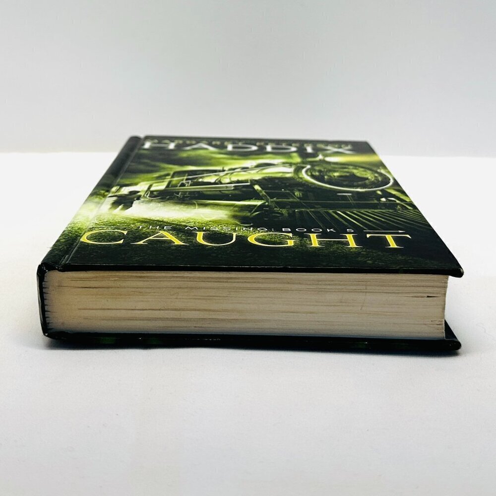 The Missing: Book 5 Caught Hardcover Book by Haddix, Margaret Peterson - Picture 3 of 7